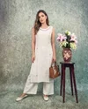 K 1189 By Naisha Rayon Jekart Manual Work Kurti With Bottom